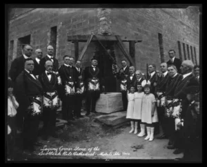 A group of people standing in front of a building.